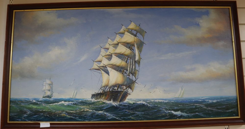 A modern oil on canvas of clipper ships at sea, 60 x 121cm